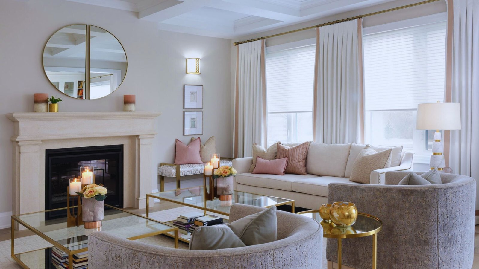 A cozy living room featuring a fireplace, two couches, and a large mirror on the wall.