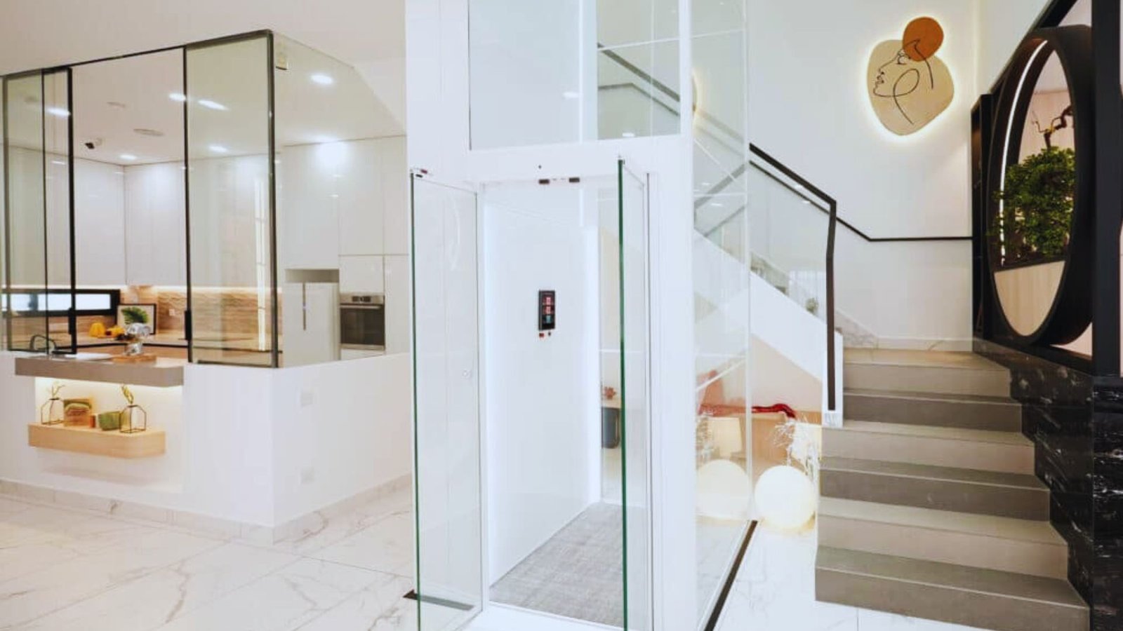 A modern elevator featuring transparent glass walls and a sleek glass door, showcasing a contemporary design.