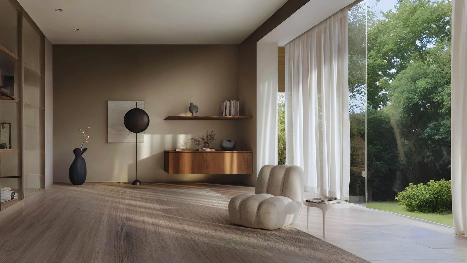 A modern living room featuring large windows that allow natural light to illuminate the wood floors.