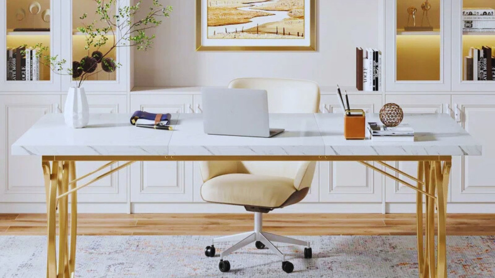 A stylish white marble desk with gold legs, showcasing an open laptop on top.