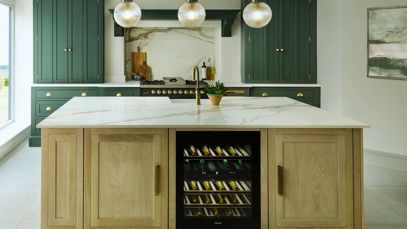 A contemporary kitchen showcasing a wine cooler alongside polished marble countertops.