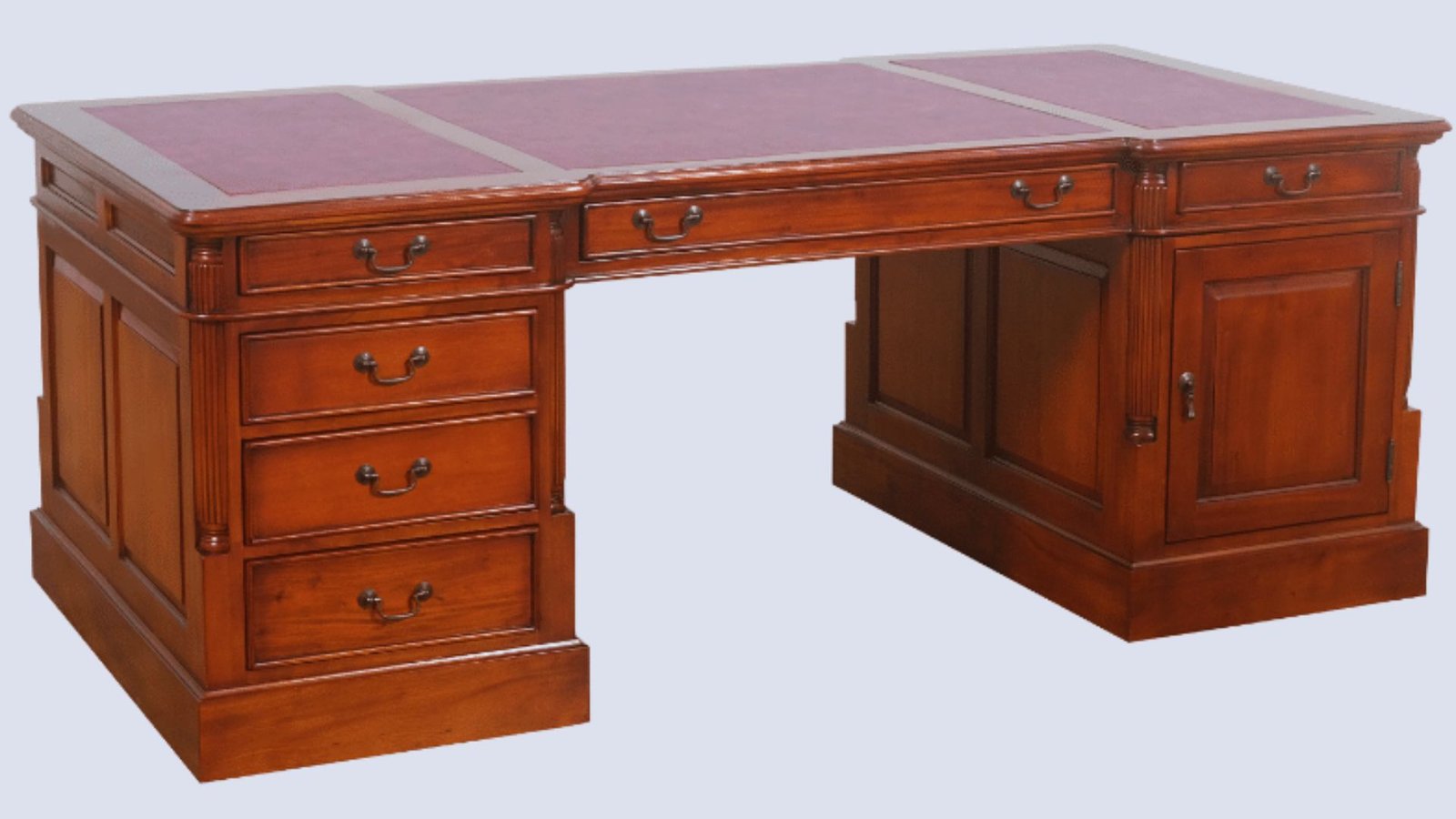 Antique desk featuring drawers and a rich red leather top, showcasing classic craftsmanship and elegant design.