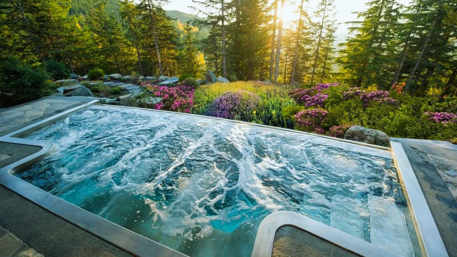 A hot tub surrounded by lush greenery in a serene forest setting, inviting relaxation in nature.