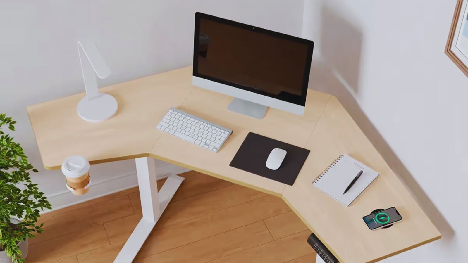 A computer desk featuring a keyboard, mouse, and monitor arranged for efficient workspace use.