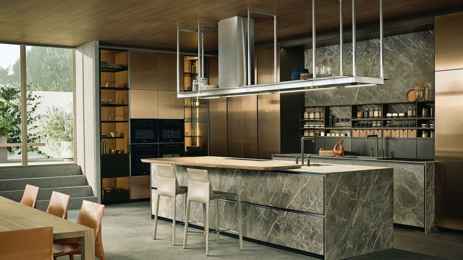 A modern kitchen featuring a sleek marble island and elegant wooden cabinets.