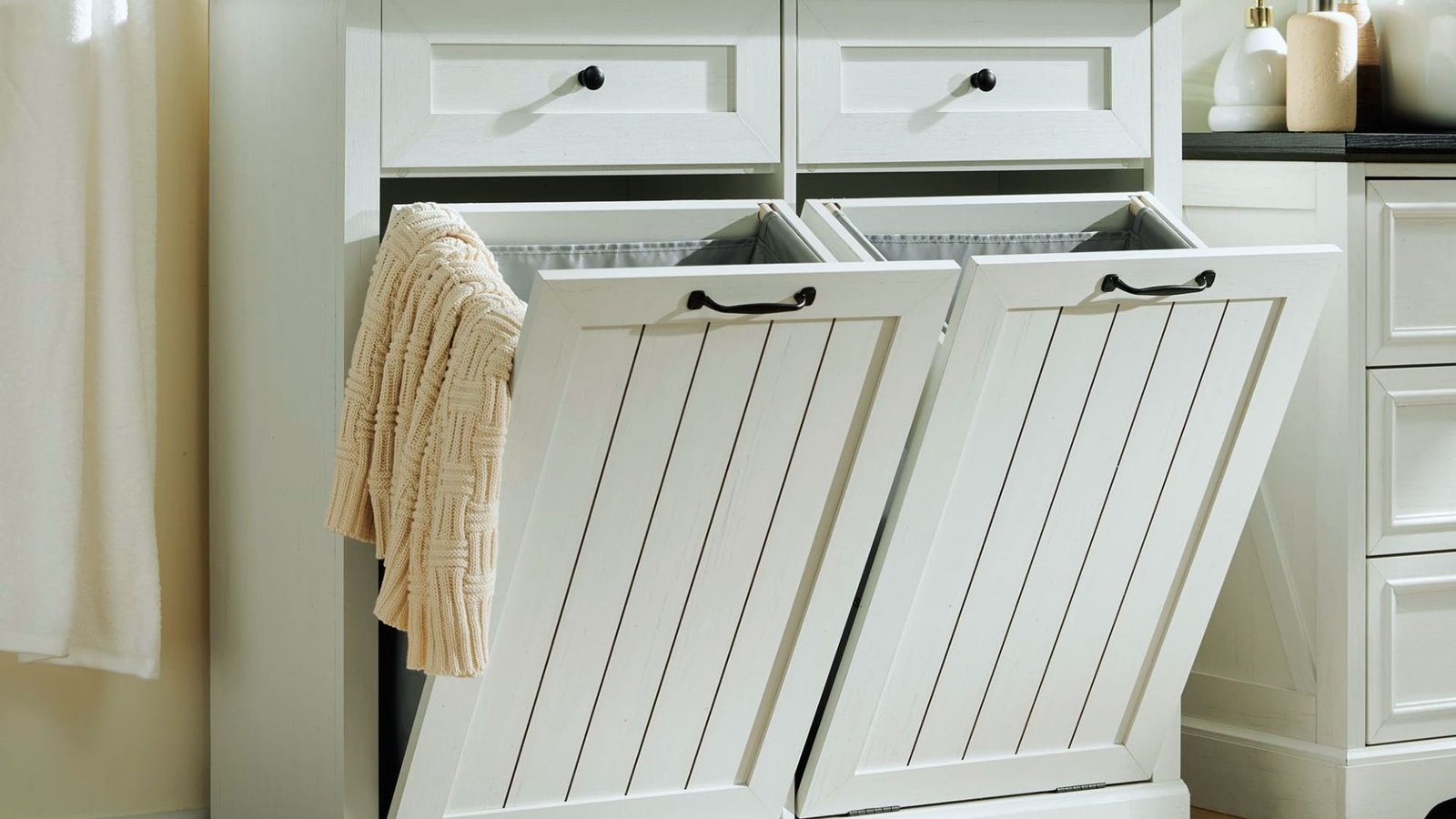 A white laundry room cabinet featuring two drawers, designed for storage and organization in a laundry space.