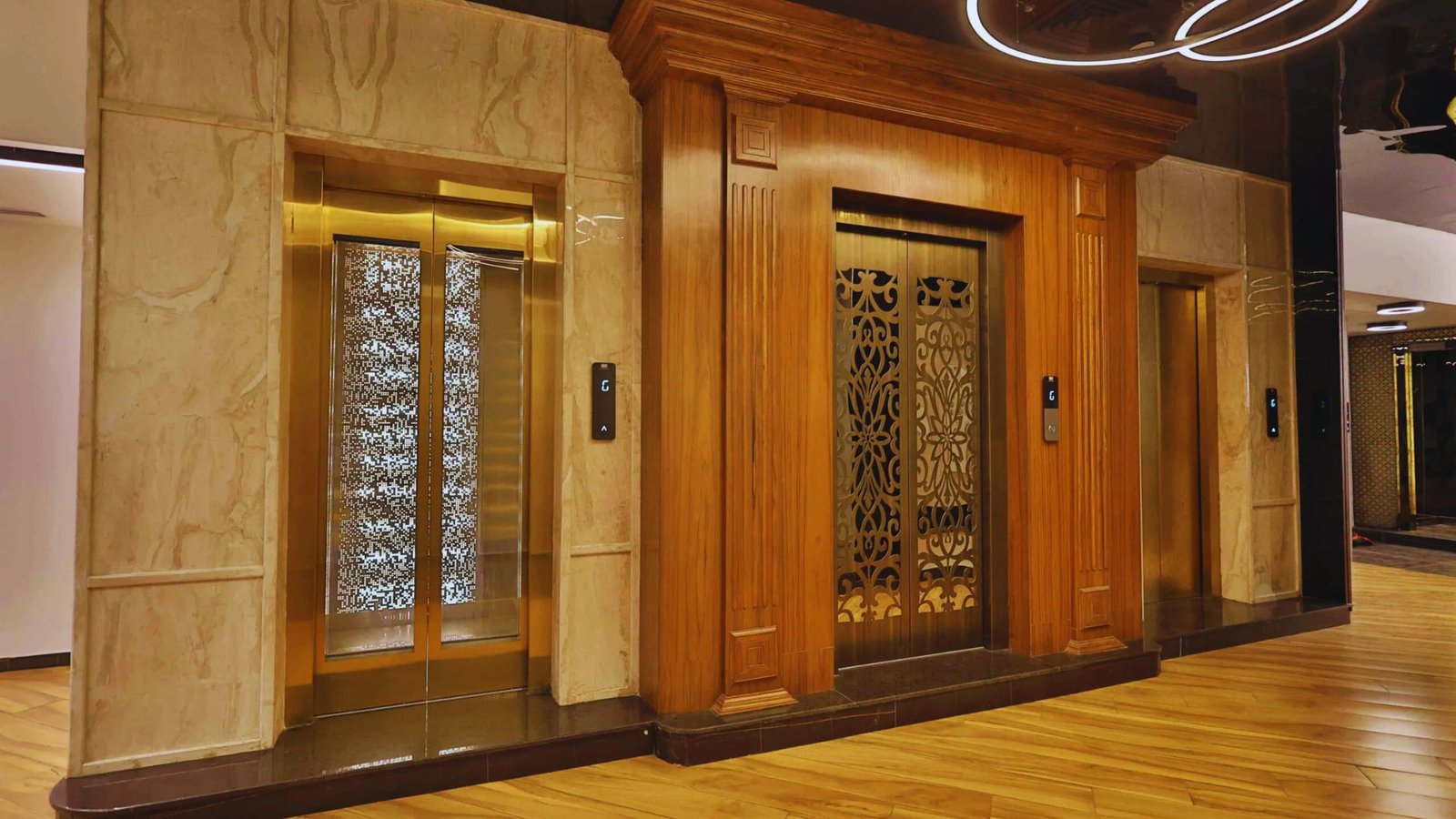 An elevator featuring a wooden door alongside a transparent glass door.
