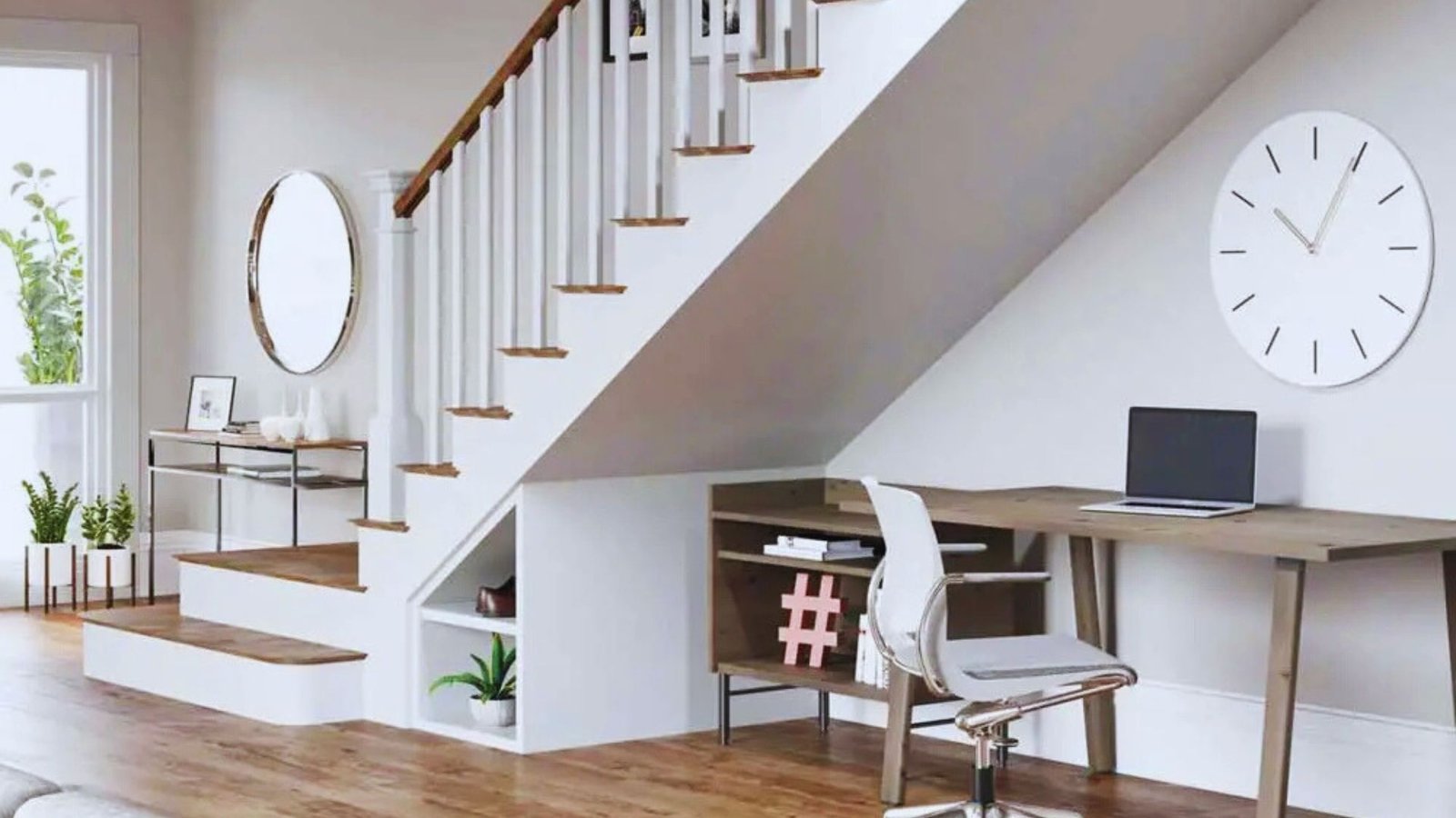 A white desk positioned under a staircase, with a clock mounted on the wall above it.
