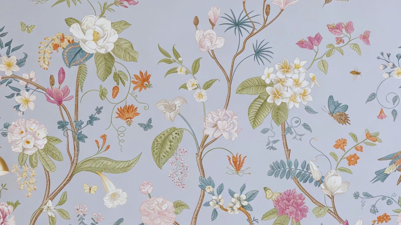 2. A blue background adorned with vibrant floral patterns in wallpaper design.
