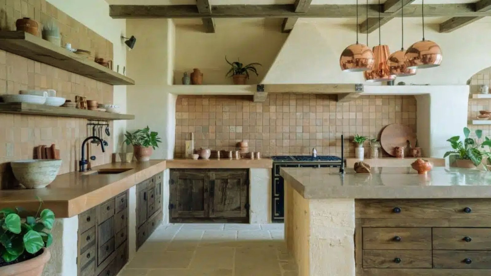 A stylish kitchen showcasing wooden beams and a large island, designed for both cooking and socializing.